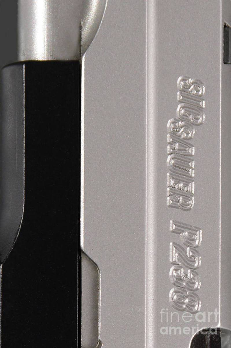 Close Up Of A Sig Sauer Pistol - Poster | Canvas Wall Art Print