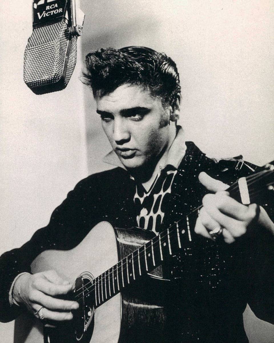 Elvis Presley Plays And Sings Into Old Microphone - Poster | Canvas Wall Art Print